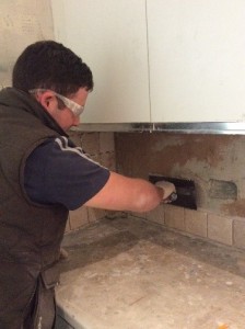 Here is Mike tiling a kitchen area. 
