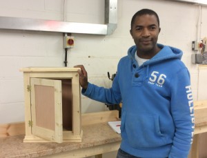 Rodney with his finished bedside cabinet on his carpentry course.