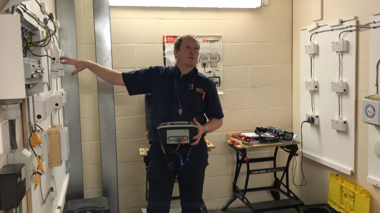 Clive passes his knowledge to the Domestic Electrical Students