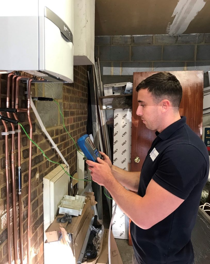 Mason Wright Gas Engineer working on a boiler