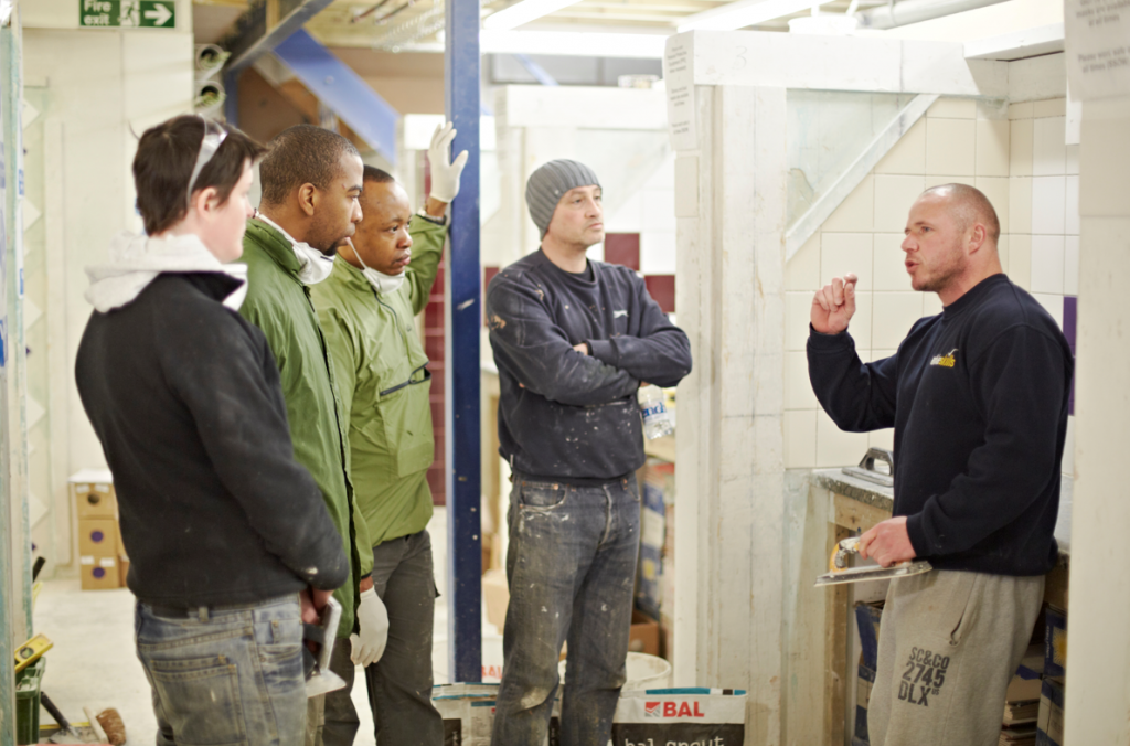 Group of students with an Able Skills instructor on the tiling course. 