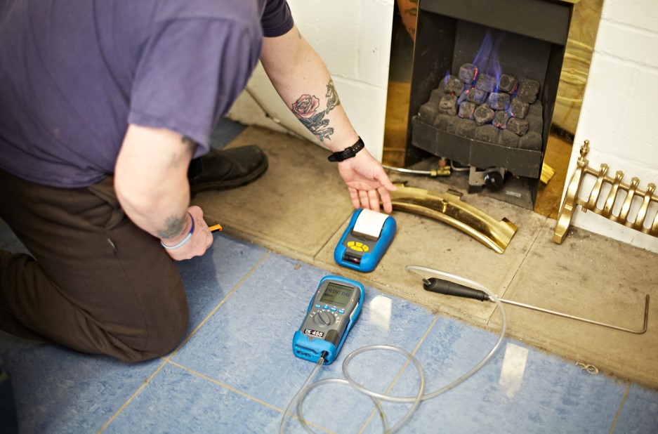 Gas engineers testing a gas fire