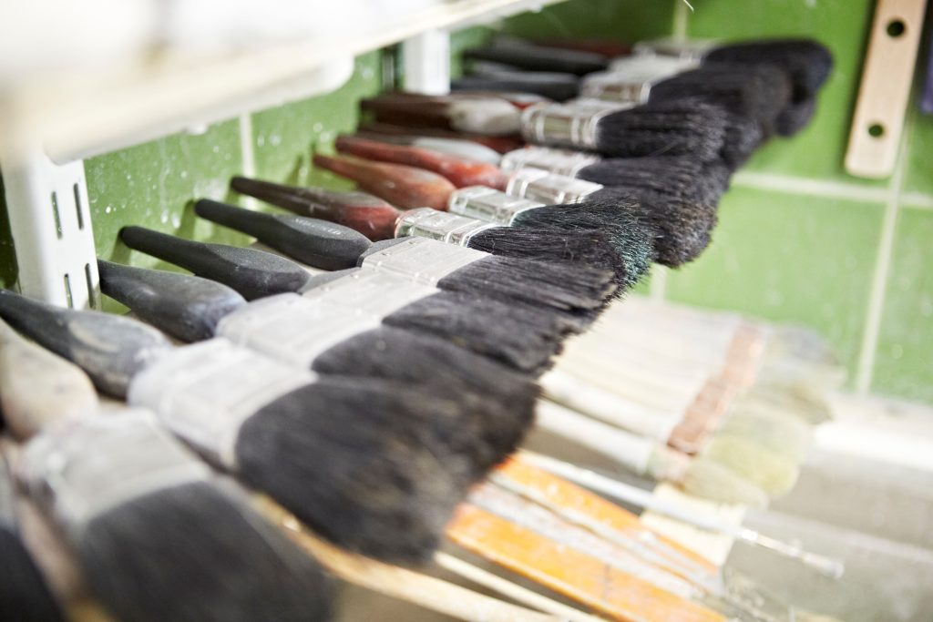 Row of paint brushes