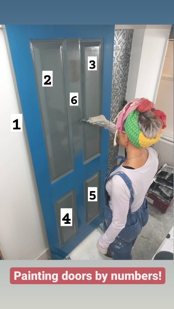 Lucy painting a door in grey paint. Caption reads: Painting doors by numbers!