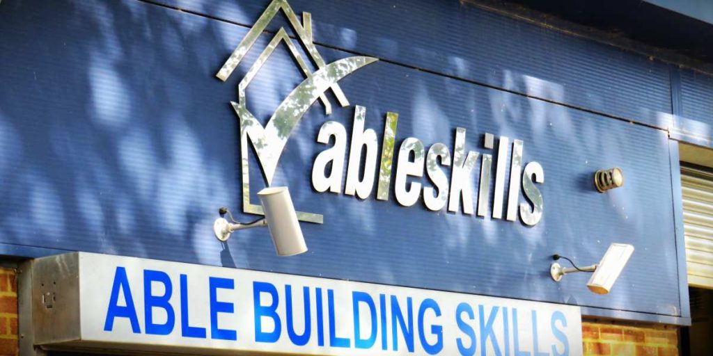 The blue sign for the Able Skills Construction Training Centre