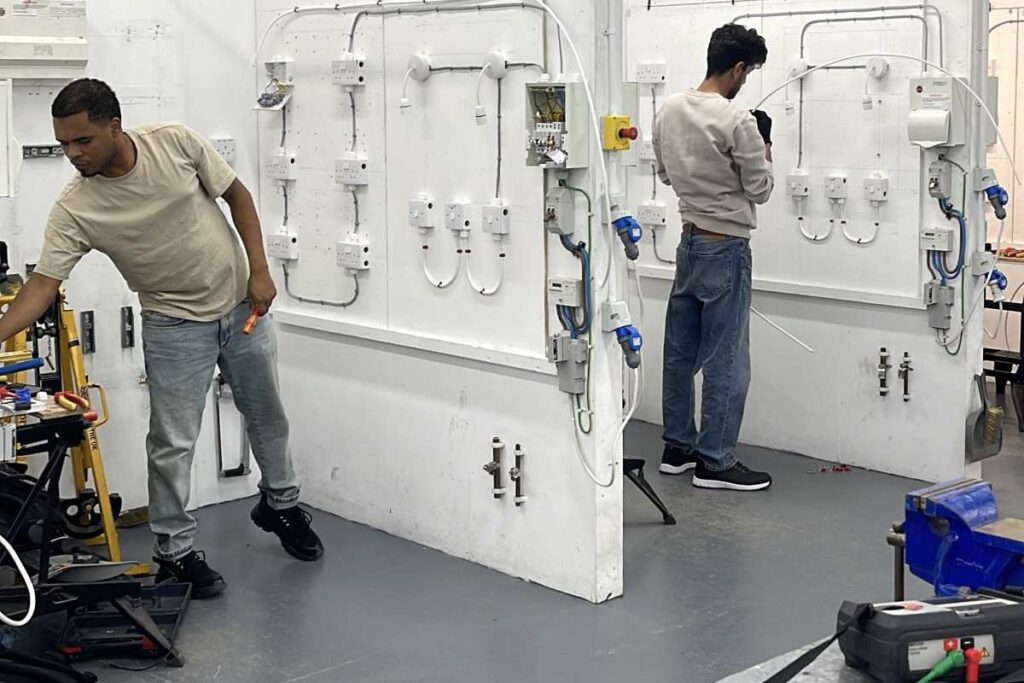 Students and instructors working in the electrical training centre at Able Skills
