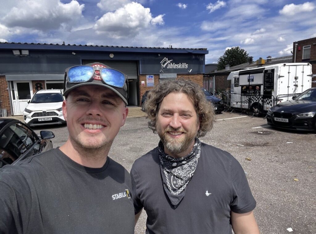 Scott with Paul outside the Able Skills training centre