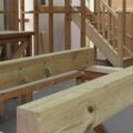 A wooden structure being built in a construction workshop