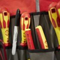 Tool bag with electrical screwdrivers and other tools you'd use when retraining to become an electrician