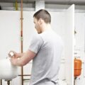 A plumber working on a water system